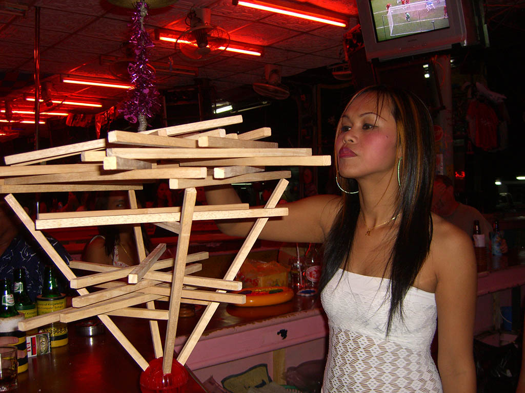 Bar girl playing a game in a beer bar compex in Pattaya