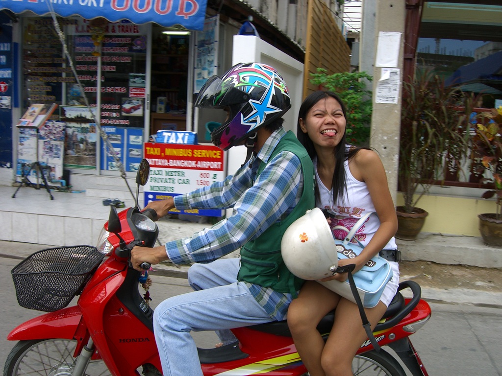 Pattaya lady on the back of a motorbike