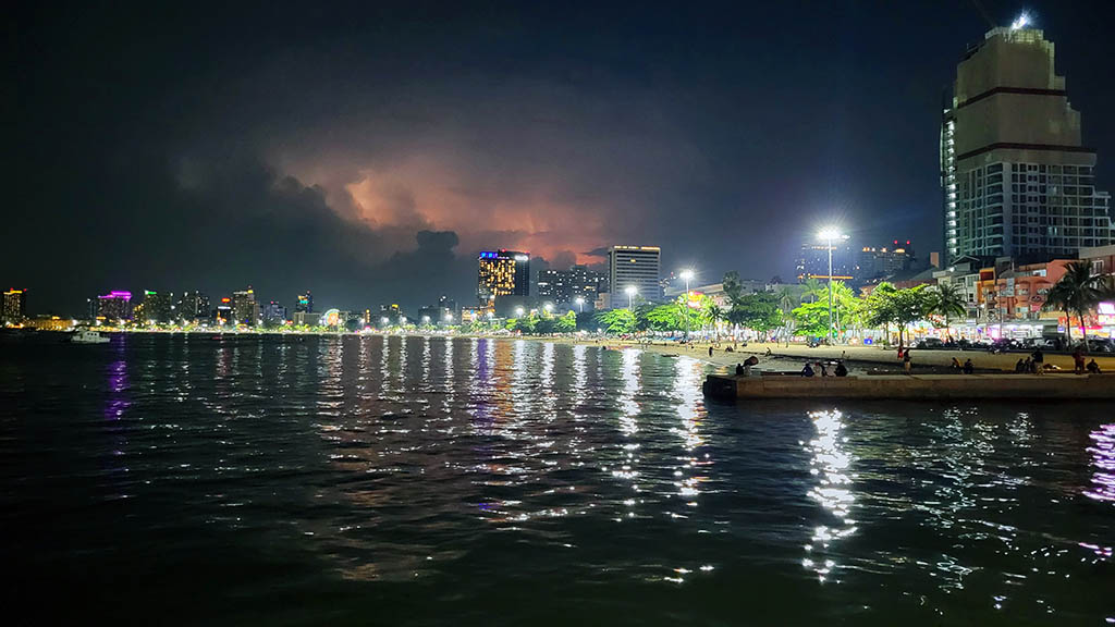 Pattaya Beach Road waterfront hotels and bay illuminated at night, showing the Central Pattaya zone for where to stay in Pattaya.